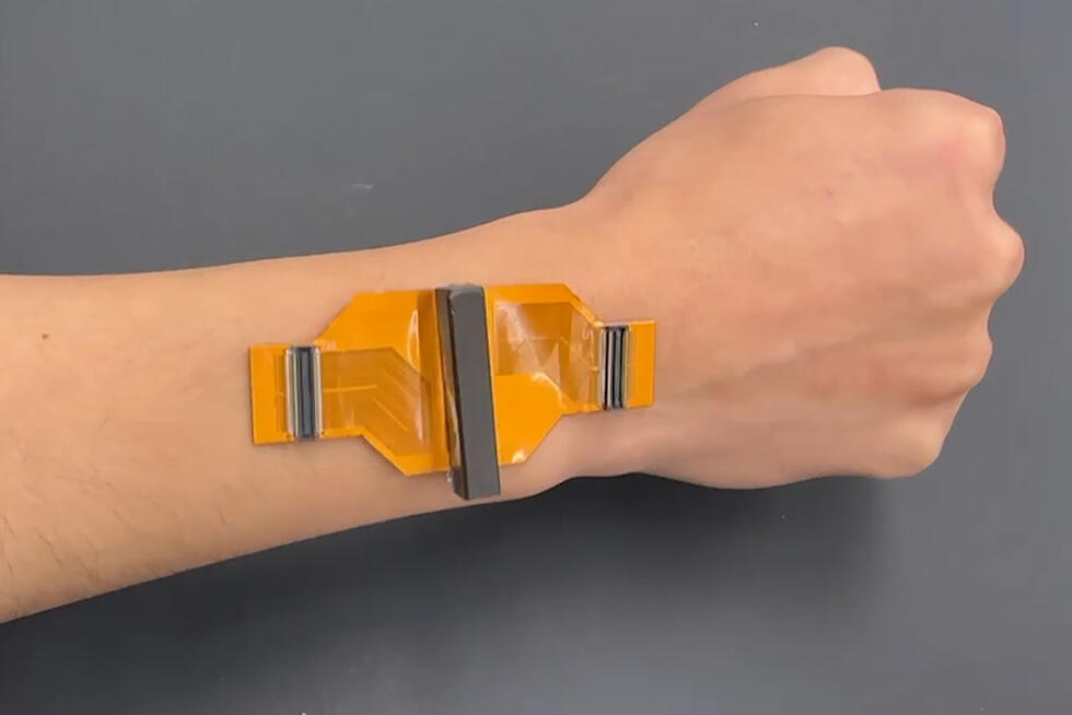 the newly developed ultrasound patch sticks on an arm